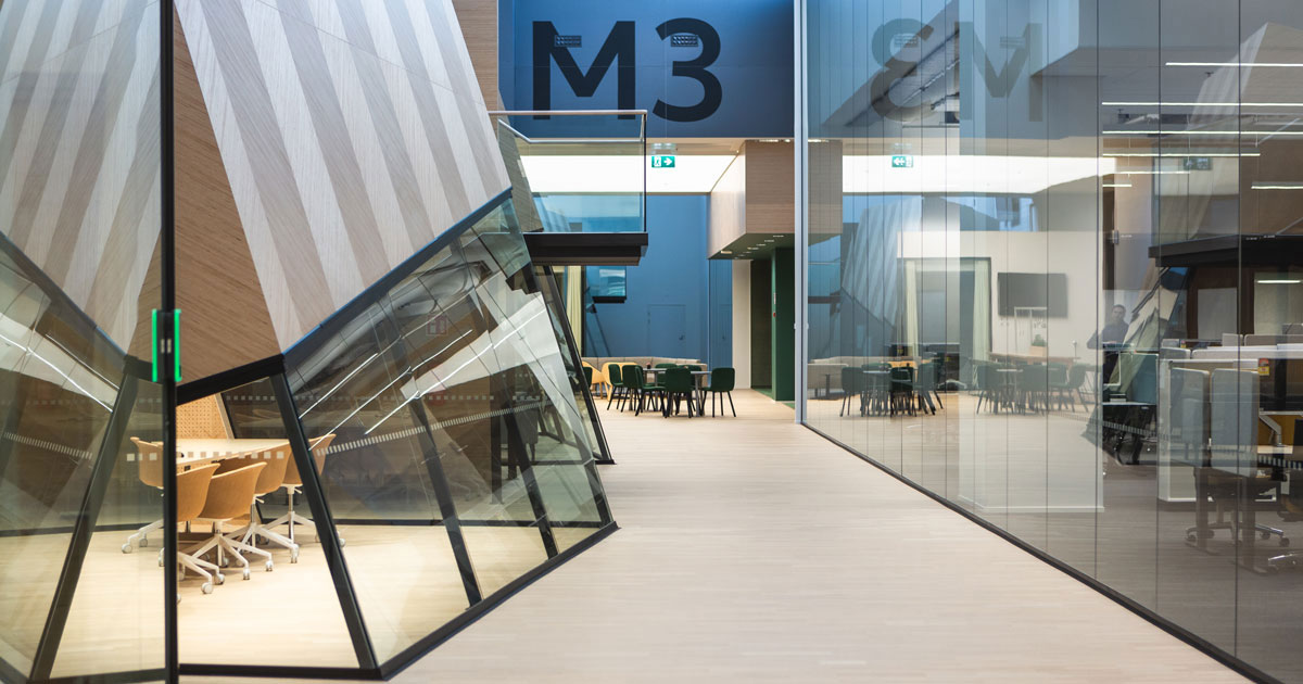 Glass partition wall systems and interior glazing structures in a modern public interior, Tambest